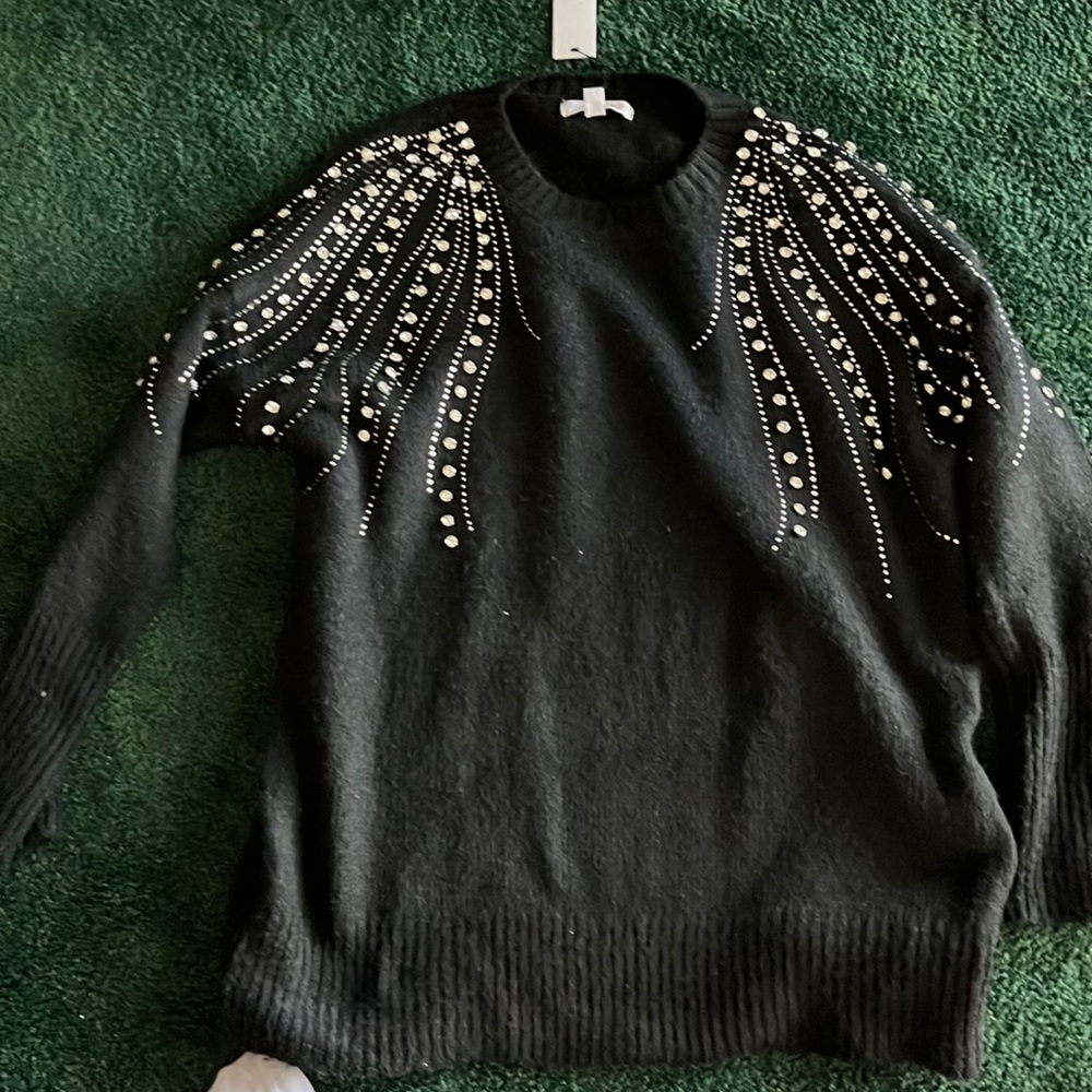 Beautiful sweater with so many rhinestones!